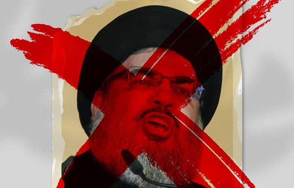 A leaflet distributed in the Syrian city of al-Hasakeh features a crossed-out photo of Hizbullah's Secretary-General Hassan Nasrallah. [Youth Union of Hasakah/Facebook]