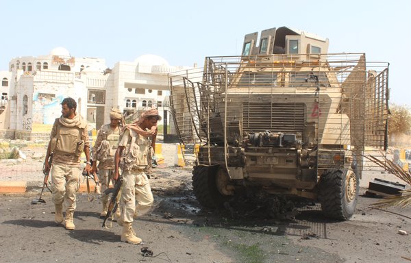 Pro-government fighters patrol in the Abyan provincial capital of Zinjibar after they recaptured the town from al-Qaeda on August 14, 2016. [Saleh al-Obeidi/AFP]