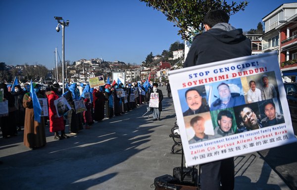 Uighurs demonstrate outside the Chinese consulate in Istanbul, Turkey, February 22, 2021, to ask for news for their relatives. [Ozan Kose/AFP]