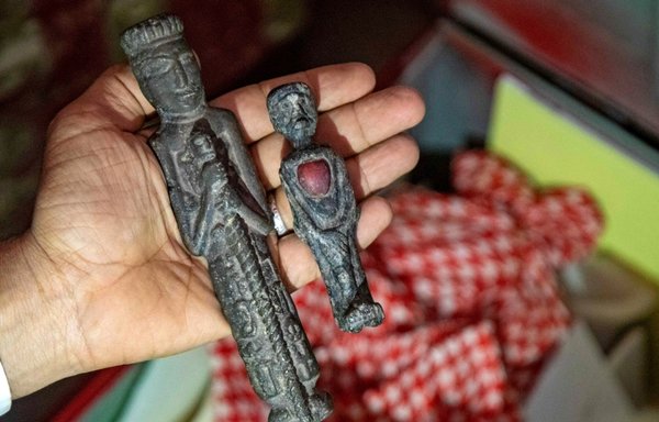 National Museum in Taez director Ramzi al-Damini on February 22 shows artefacts that were recovered before being smuggled out of the country. [Ahmad al-Basha/AFP]