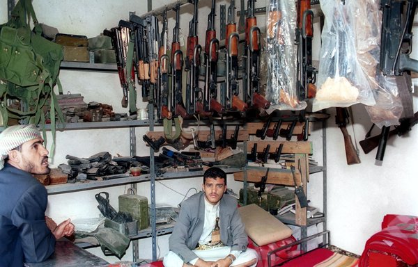 A Yemeni salesman sits in his shop in July 2001 at the Jehanah weapons market 35 kilometres north of Sanaa, a well-known market for light and heavy guns. [Khaled Fazaa/AFP]