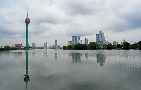 The Lotus Tower, a floral-shaped skyscraper bankrolled by Chinese funds, is pictured in Colombo, Sri Lanka, on May 5. The tower's colourful glass facade dominates the capital's skyline, but its interior has never been opened to the public. [Ishara S. Kodikara/AFP]