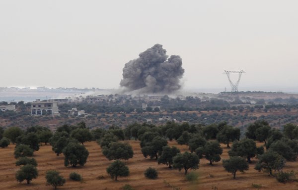 Smoke billows following a reported Russian air strike in southern Idlib province, Syria, near the village of Rakaya, on October 24, 2019. [Abdulaziz Ketaz/AFP]