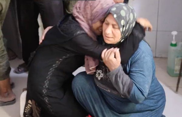 A family mourns the death of four children killed in a July 22 air strike in the vicinity of Jisr al-Shughur in Idlib province, Syria. The siblings were all under the age of 10. [White Helmets]