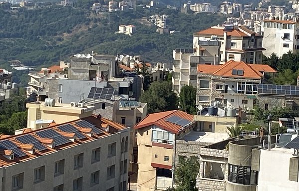 Solar energy panels, seen here July 24 on rooftops in Beirut's Mazraat Yachou, are increasingly popular as a way to provide electricity for daily needs. [Nohad Topalian]