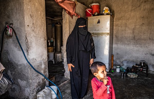 Nora, 31, a former detainee at al-Hol camp where relatives of suspected ISIS fighters are held, gives an interview at her home in al-Raqa city on June 4. Nora married an ISIS supporter and then wound up without her husband in al-Hol. She has been back in her hometown outside al-Raqa for three years. [Delil Soulieman/AFP]