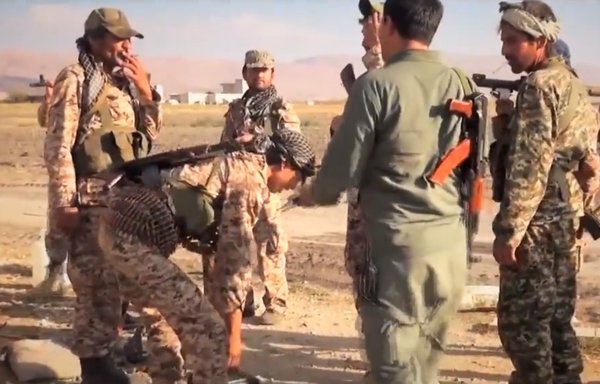 Fatemiyoun Division elements are seen here in 2021 in Syria's eastern desert (Badiya) near the city of Palmyra in a screenshot from a propaganda video.