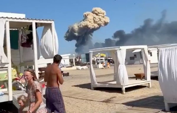 Russian tourists in Crimea August 9 look on in shock after explosions rock a Russian military base on the peninsula. [File]