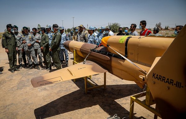 Iranian commanders review newly produced drones on August 24. [Iranian Ministry of Defence]