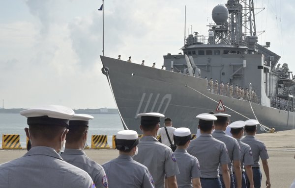 Taiwanese naval personnel walk in front of a frigate as President Tsai Ing-wen (not pictured) inspects troops on the Penghu islands on August 30. [Sam Yeh/AFP]