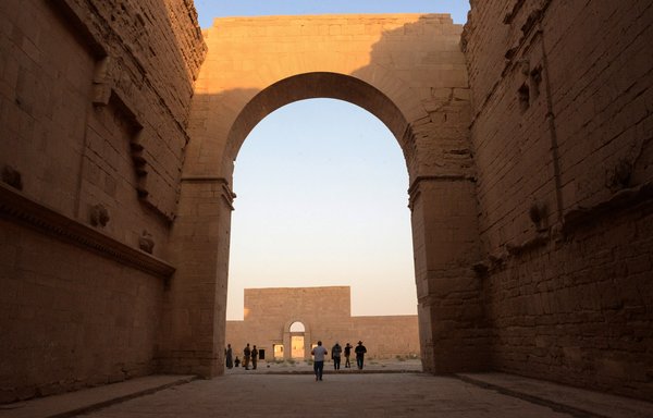 A group of tourists visit the ancient city of Hatra on September 10. Reconstruction remains slow, and Ninawa province still shows the scars of the battle against ISIS. [Zaid al-Obeidi/AFP]