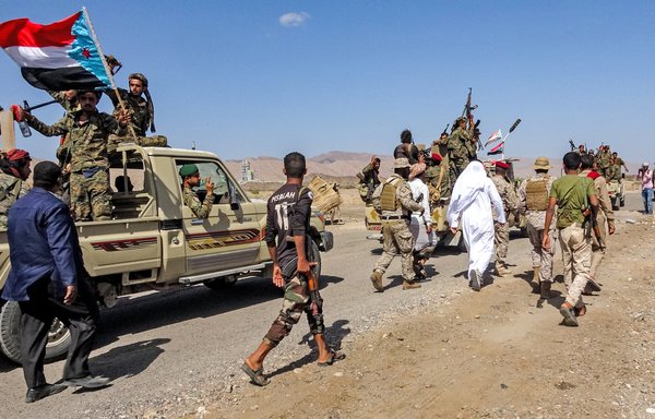 Fighters loyal to Yemen's Southern Transitional Council travel in a convoy in Abyan province on December 13, 2020. [AFP]