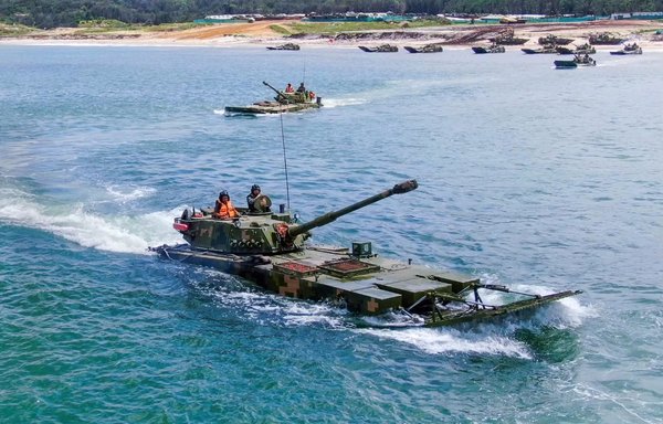 Chinese military personnel in June simulate an invasion using amphibious landing vehicles, which Beijing vows to use one day against Taiwan. [Chinese Ministry of Defence]