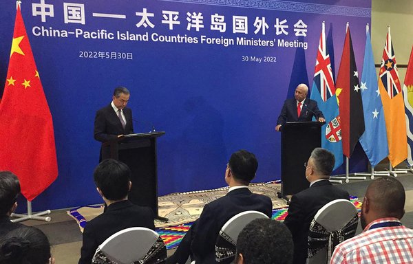 Chinese Foreign Minister Wang Yi and Fijian Prime Minister Frank Bainimarama attend a joint news conference in Fiji's capital, Suva, on May 30. During the conference, the leaders of 10 Pacific island nations rebuffed China's push to bring them into Beijing's orbit. [Leon Lord/AFP]