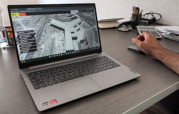 Diab Serriya of The Association of Detainees and The Missing in Sednaya Prison views a page on the prison on the Amnesty International website at his office in Gaziantep, Turkey, on August 11. [Omar Haj Kadour/AFP]