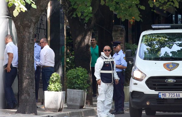 Members of the Albanian scientific police unit enter Iran's embassy in Tirana on September 8. Albania broke diplomatic ties with Iran one day earlier over an alleged cyber-attack. [Gent Shkullaku/AFP]