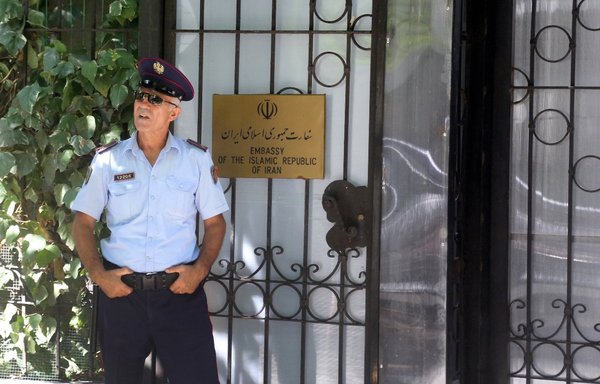 A police officer stands guard outside the Iranian embassy in Tirana, Albania, on September 7, the day Albania cut diplomatic ties with Iran. [Gent Shkullaku/AFP]