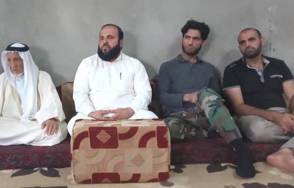 Sheikh Fadi al-Asimi (seated behind ottoman), seen here in a photo published July 13, 2021, was assassinated in Daraa for rejecting Iranian expansion in the region. [Zaytouna Magazine]