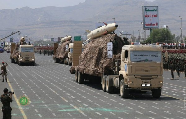 An image made available by the Houthis on September 21 shows trucks carrying missiles during a military parade in Sanaa. [Al-Huthi Group Media Office/AFP]