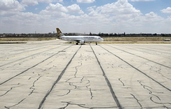 A Cham Wings Airlines Airbus is pictured at Aleppo airport in Syria after flights were diverted from Damascus airport on June 15. [AFP]