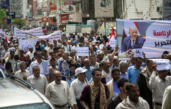 In this photo taken July 26, Yemeni demonstrators demand the end of a years-long Houthi blockade of the city of Taez. [Ahmad al-Basha/AFP]