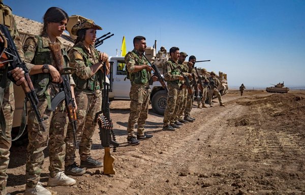 Fighters of the Syrian Democratic Forces attend a joint military exercise with forces of the US-led international coalition against ISIS near al-Malikiya in Syria's al-Hasakeh province on September 7. [Delil Souleiman/AFP]
