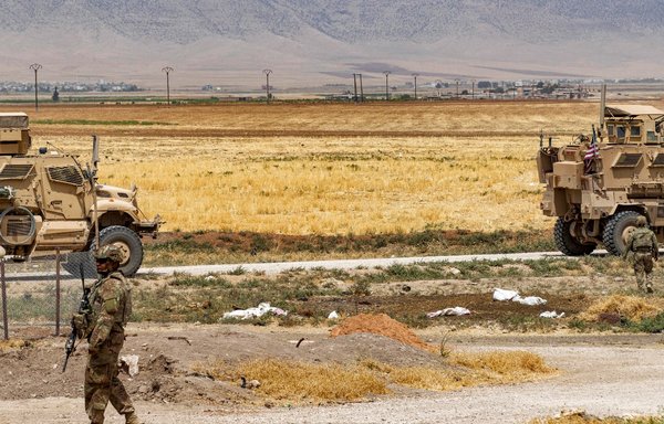 US soldiers patrol in a rural area east of Qamishli in Syria's northeastern al-Hasakeh province on August 21. [Delil Souleiman/AFP]