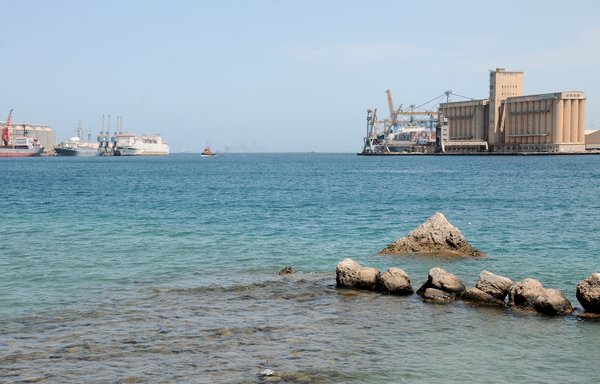A general view shows docked ships at the harbour of the Sudanese city of Port Sudan, on April 27, 2021. The Sudanese navy said it seized a vessel smuggling Iranian arms in its territorial waters on September 24. [Ibrahim Ishaq/AFP]