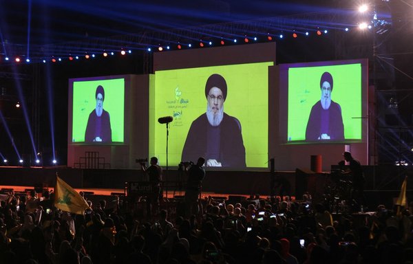 Hizbullah leader Hassan Nasrallah delivers a speech in Beirut's southern suburb on August 22. [Anwar Amro/AFP]