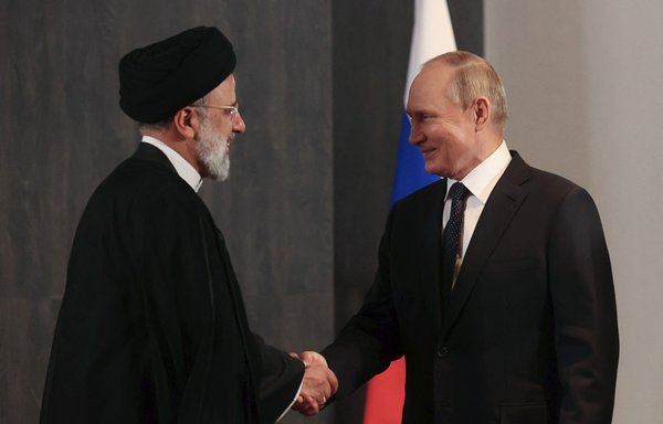 Russian President Vladimir Putin meets with his Iranian counterpart Ebrahim Raisi on the sidelines of the Shanghai Co-operation Organisation leaders' summit in Samarkand on September 15. [Alexandr Demyanchuk/Sputnik/AFP]