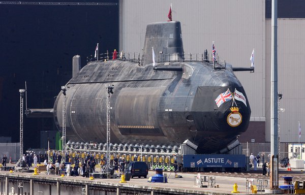 The first Astute-class nuclear submarine is brought out of the Devonshire Dock Hall at the BAE Systems production plant in Barrow-in-Furness, England, June 8, 2007. The new submarine, the first of four, was named HMS Astute by Camilla, Duchess of Cornwall. [Paul Ellis/AFP]