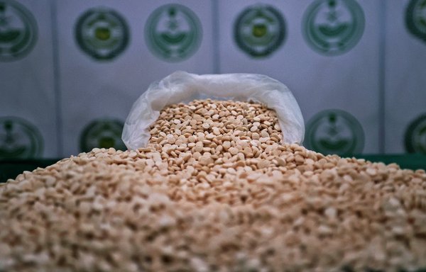 This picture taken on March 1 shows a cache of Captagon pills seized by the Saudi Directorate of Narcotics Control during a raid. [Fayez Nureldine/AFP]