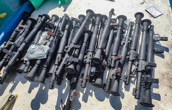 The US Navy seized a large cache of weapons, including Kalashnikov-style rifles and rocket-propelled grenade launchers, from a smuggler's ship off the coast of Somalia on February 11 and 12, 2021. [US Navy]