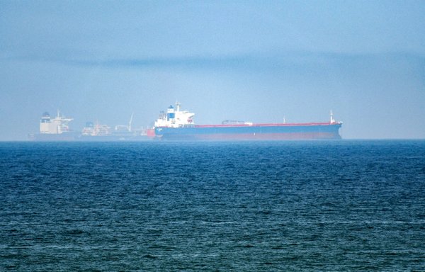 This picture taken on June 15, 2019, shows tanker ships in the waters of the Gulf of Oman off the coast of the eastern UAE emirate of Fujairah. [Guiseppe Cacace/AFP]