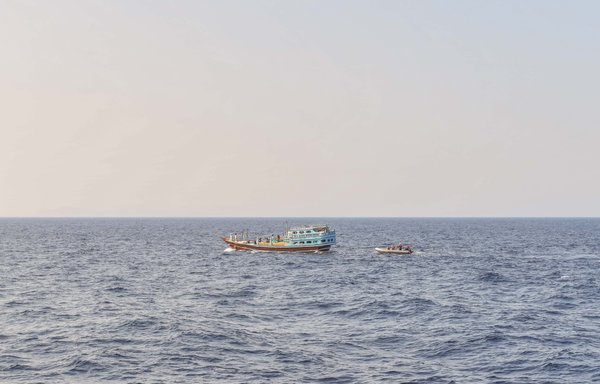 US naval forces approach a fishing vessel transiting international waters in the Gulf of Oman on November 8, during an interdiction. [US Navy]