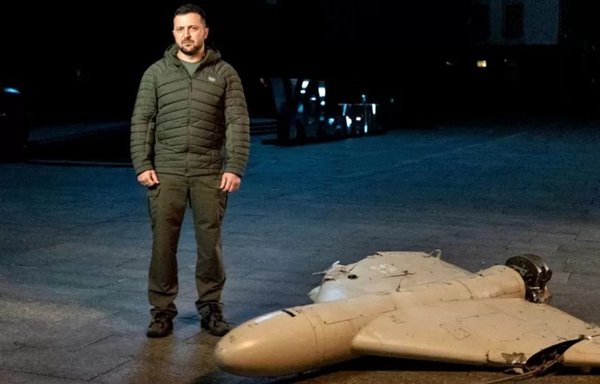 Ukrainian president Volodymyr Zelenskyy stands next to the remnants of an Iranian drone on October 28. [President.gov.ua]