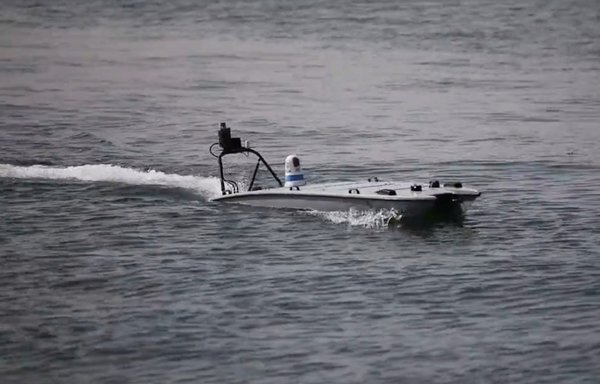 A screen grab from a video shows MANTAS T-12 unmanned surface vessels operating in the Arabian Gulf on October 20, 2021 alongside US Navy crewed assets. This was the first unmanned/manned teaming activity underway for the US 5th Fleet's new Task Force 59. [US 5th Fleet]