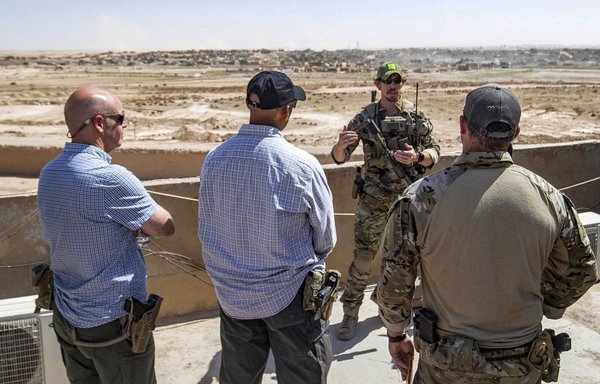 Brig. Gen. Karl Harris (2nd-L), deputy commander of the US-led Combined Joint Task Force-Operation Inherent Resolve coalition against ISIS, attends a briefing at al-Hol camp in northeastern Syria's al-Hasakeh province on August 29. [Delil Souleiman/AFP]