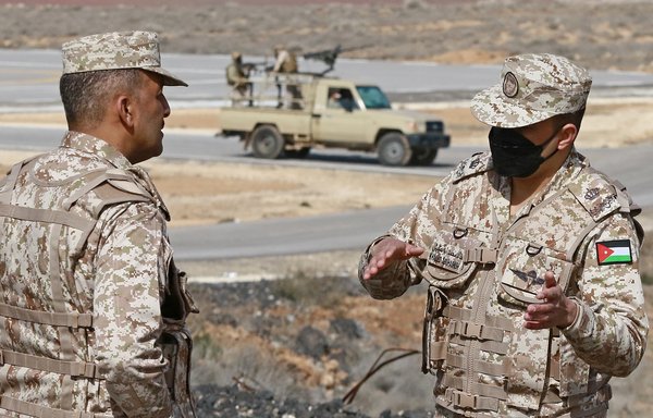 Jordanian soldiers patrol along the border with Syria to prevent drug trafficking on February 17. [Khalil Mazraawi/AFP]