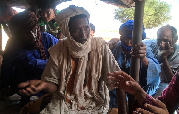 Malian refugees sit under a tent at the Mbera refugee camp in southeastern Mauritania on September 29, 2017. [Selim Saheb Ettaba/AFP]