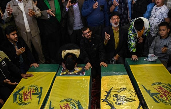 Members of Iran-backed militias who fought and died in Syria are buried in Qom, Iran, in November. [Mohammad Vahdati/IRIB News]