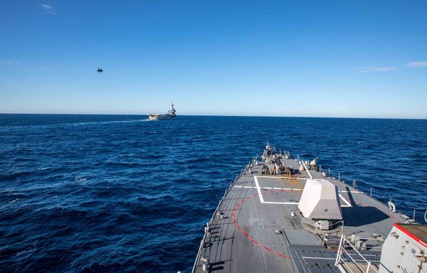 The USS Roosevelt accompanies the French aircraft carrier Charles de Gaulle on November 21. [US Navy]