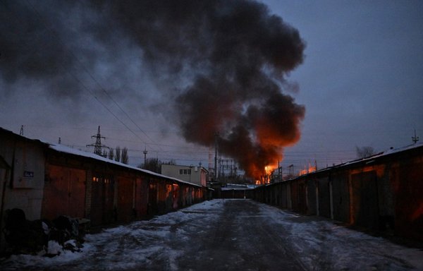 Critical power infrastructure burns after a drone attack on Kyiv, Ukraine, early December 19, amid the Russian invasion of that country. [Sergei Supinsky/AFP]
