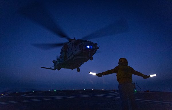 A helicopter lands on the Charles de Gaulle on December 17. [French Navy]