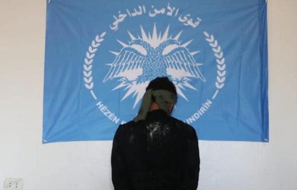 Security forces inside al-Hol camp detained this man on December 6 for allegedly attempting to carry out an assassination using a pistol equipped with a silencer. [Internal Security Forces of North and East Syria]