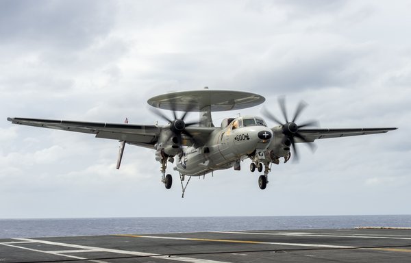 An E-2C Hawkeye approaches for an arrested landing aboard the aircraft carrier USS Nimitz on December 26 in the Philippine Sea. [US Navy]