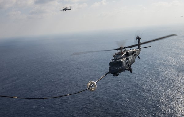 An HH-60 Pave Hawk helicopter refuels off Japan. [US Air Force]