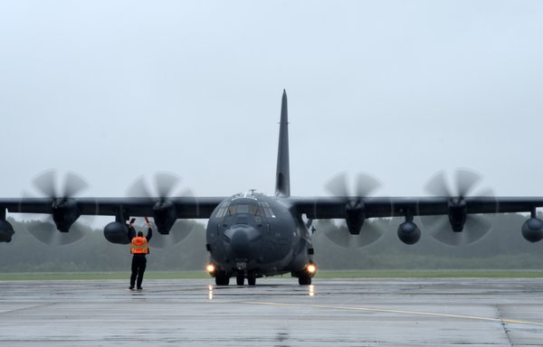 Airmen and equipment arrive aboard an HC-130J Combat King II aircraft. [US Air Force]