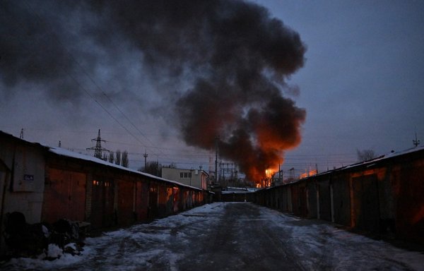 This photograph shows a fire at a critical power infrastructure site in Kyiv after a December 19 drone attack on the Ukrainian capital, amid the Russian invasion of Ukraine. [Sergei Supinsky/AFP]