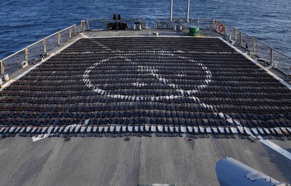Thousands of AK-47 assault rifles sit on the flight deck of guided-missile destroyer USS The Sullivans during an inventory process on January 7. [US Navy]